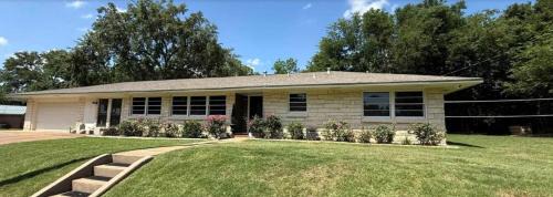 This spacious 4-BDRM, 2-BA home is a western YeeHaw Haven